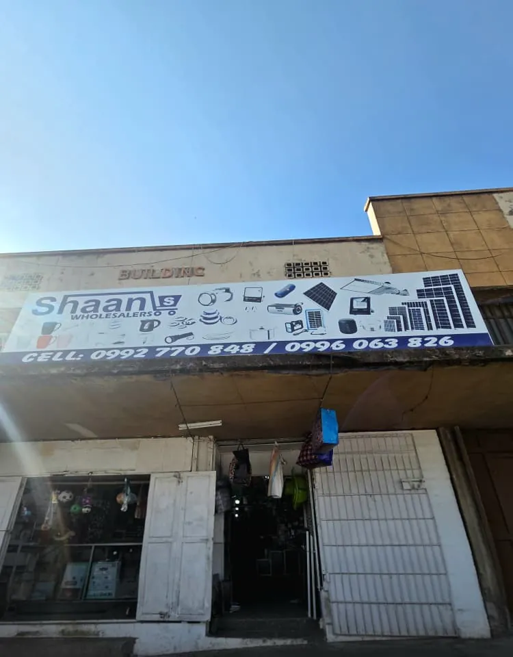 Shaan Wholesalers shopfront sign with our phone numbers