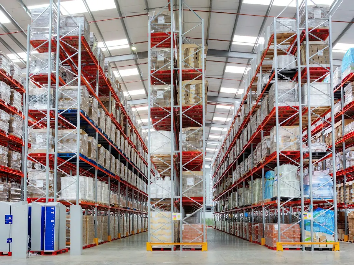 Tall warehouse racking stocked with goods